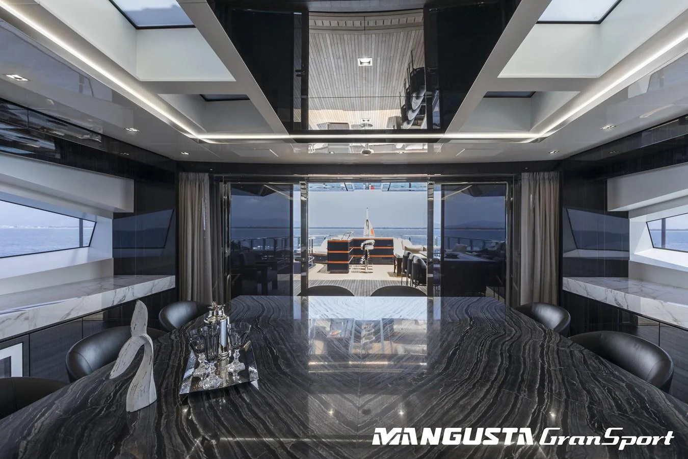 a room with a view of the ocean and the deck aboard RR Yacht for Sale