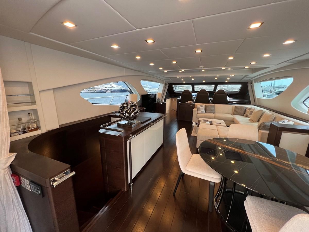 a room with a desk and chairs aboard MANGUSTA MAXIOPEN 94#2 - MISS BUBBLES - CAREFULLY USED Yacht for Sale