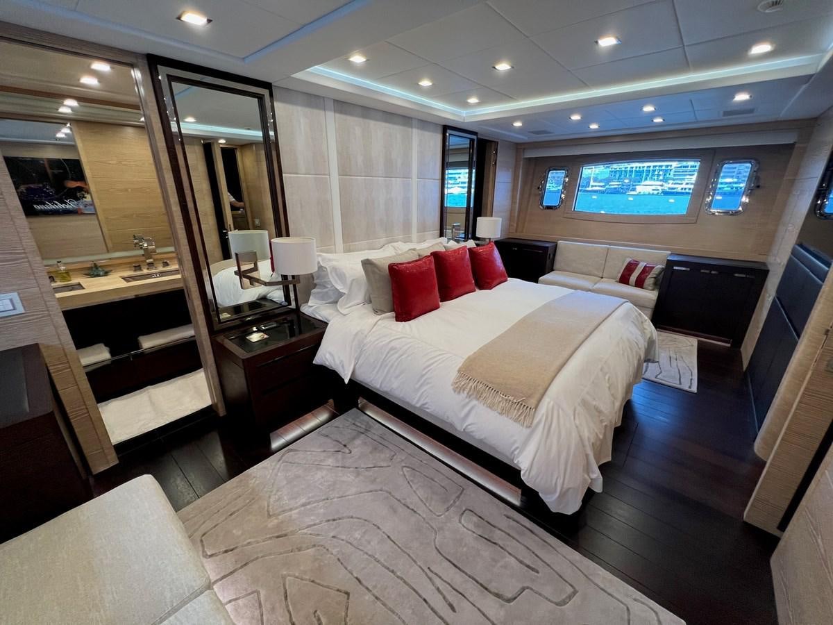 a hotel room with a bed and a desk aboard MANGUSTA MAXIOPEN 94#2 - MISS BUBBLES - CAREFULLY USED Yacht for Sale