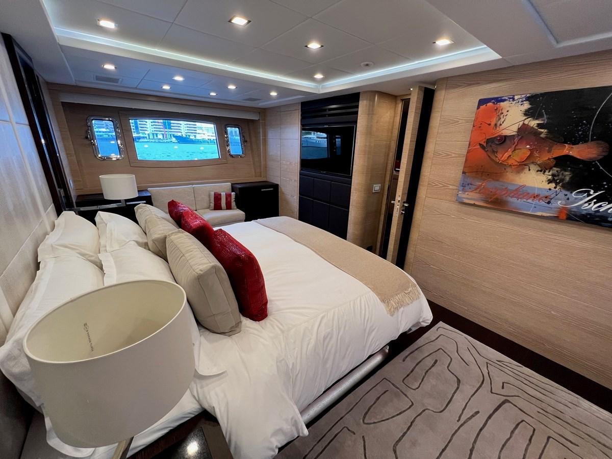 a hotel room with a bed aboard MANGUSTA MAXIOPEN 94#2 - MISS BUBBLES - CAREFULLY USED Yacht for Sale