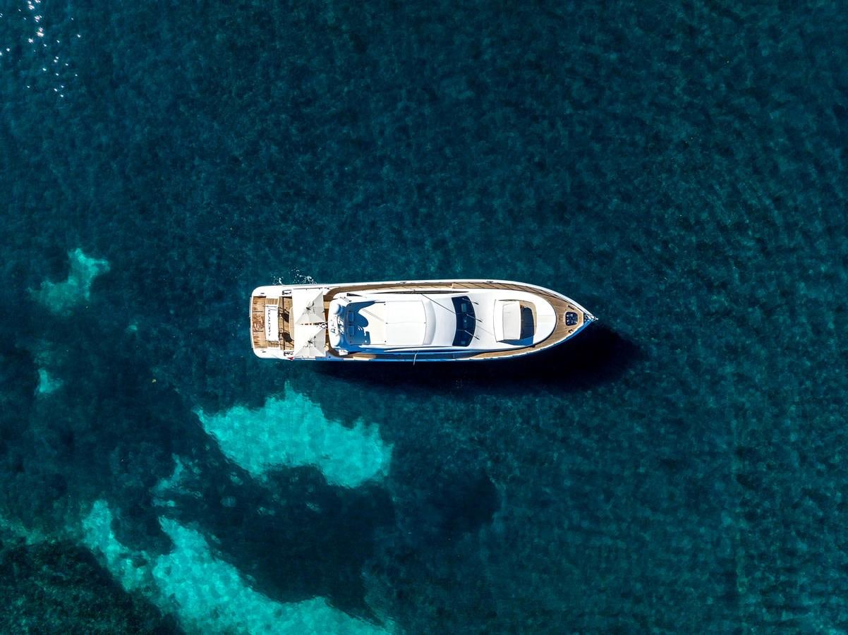 a small boat in the water aboard CLAUDIA'S Yacht for Sale