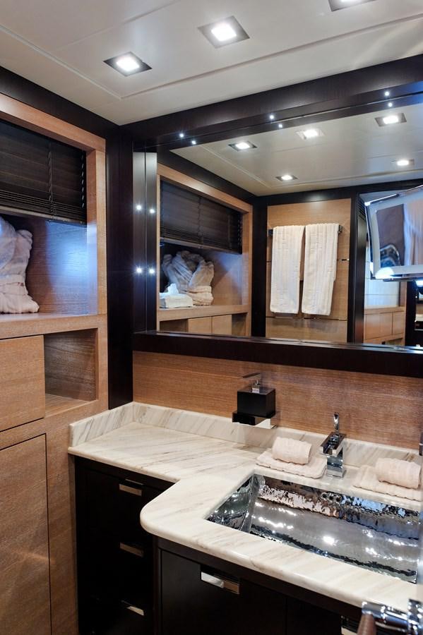 a bathroom with a large mirror aboard CLAUDIA'S Yacht for Sale