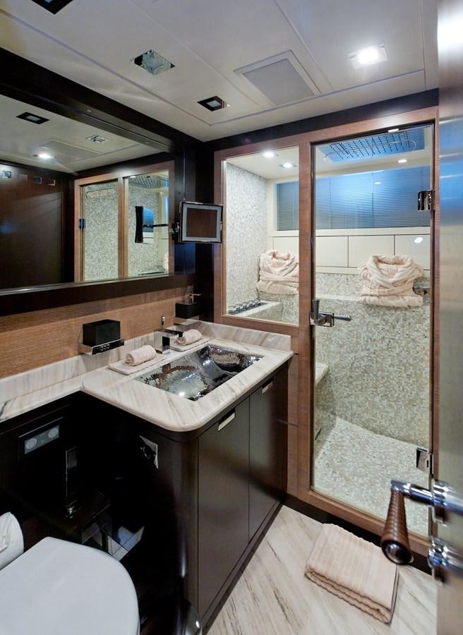 a bathroom with a large mirror aboard CLAUDIA'S Yacht for Sale
