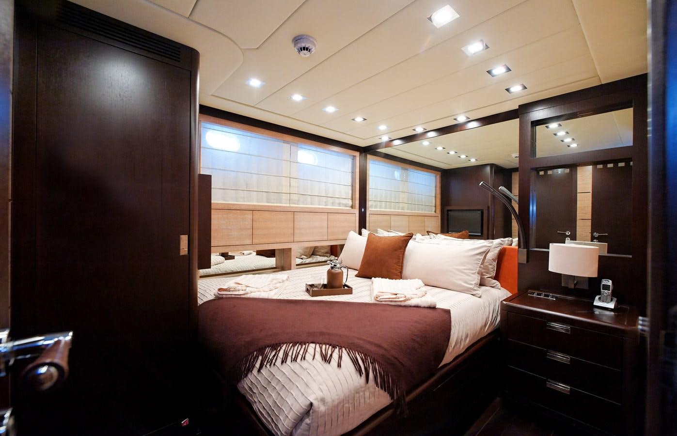 a room with a bed and a mirror aboard CLAUDIA'S Yacht for Sale