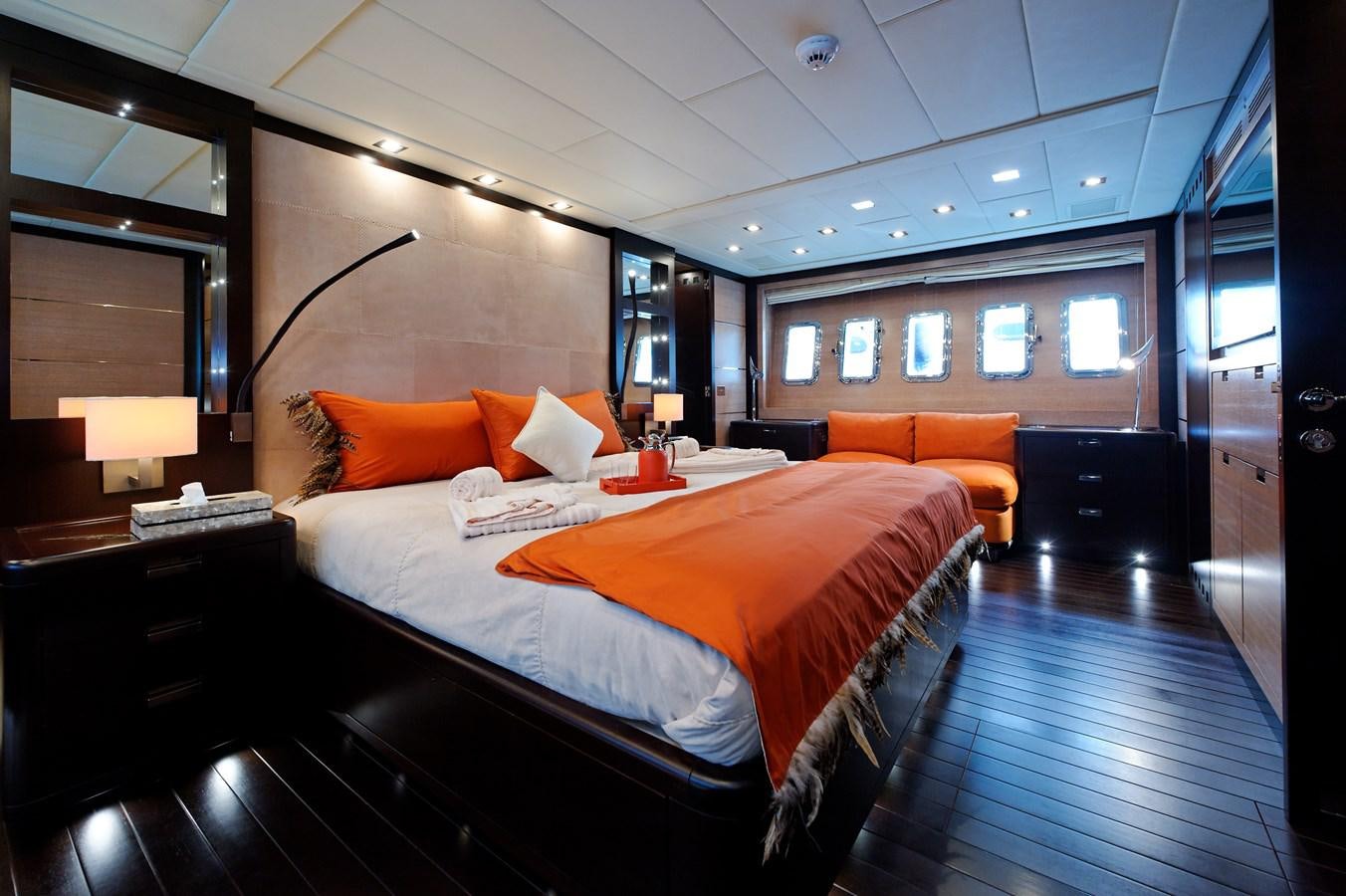 a room with a bed and a desk aboard CLAUDIA'S Yacht for Sale