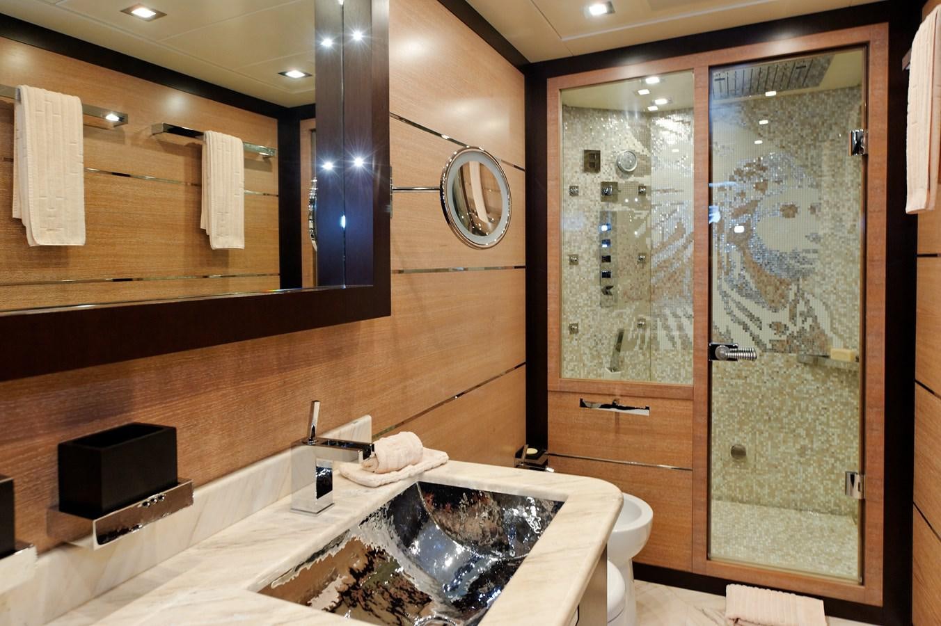 a bathroom with a large mirror aboard CLAUDIA'S Yacht for Sale