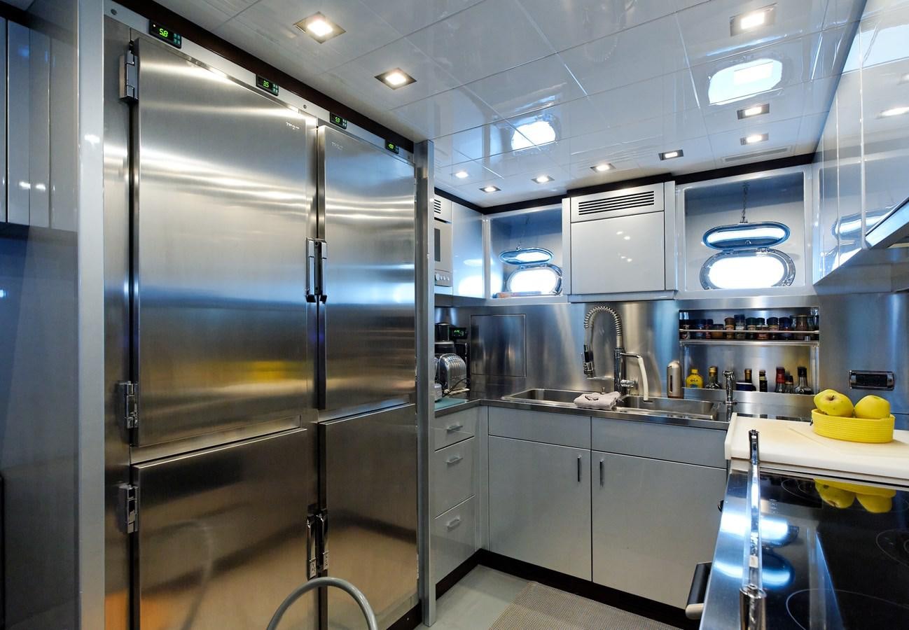 a large kitchen with stainless steel appliances aboard CLAUDIA'S Yacht for Sale