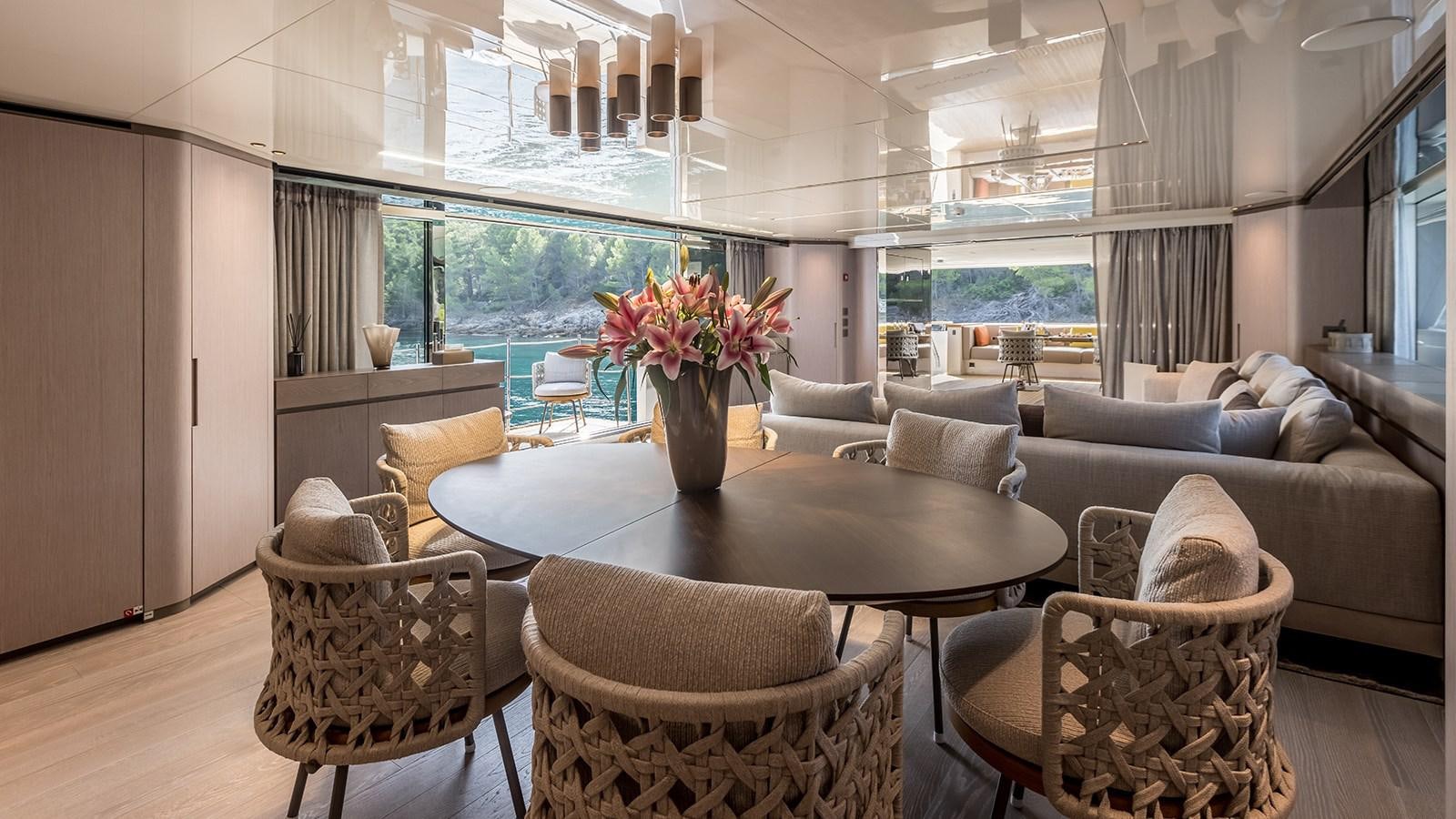 a living room with a large window aboard EROS Yacht for Sale