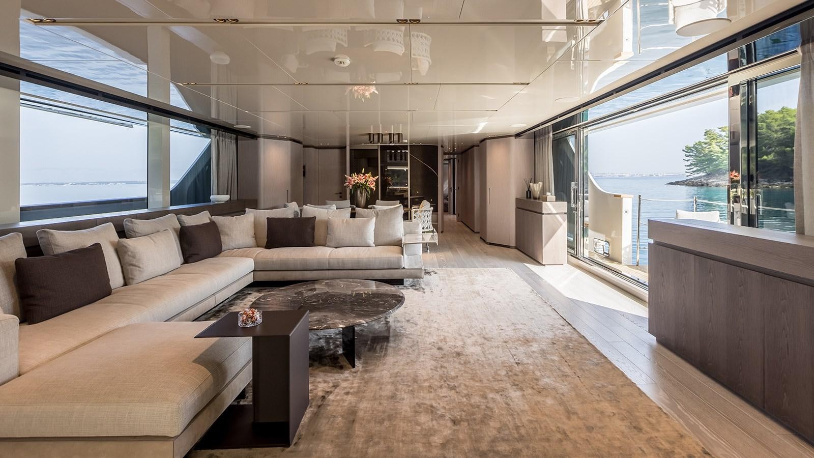 a living room with a large window aboard EROS Yacht for Sale