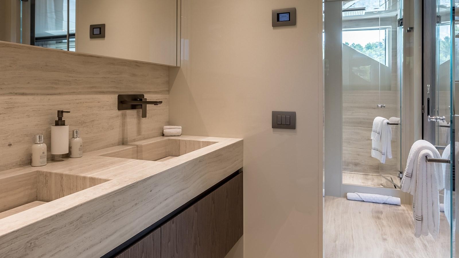 a bathroom with a sink and a mirror aboard EROS Yacht for Sale