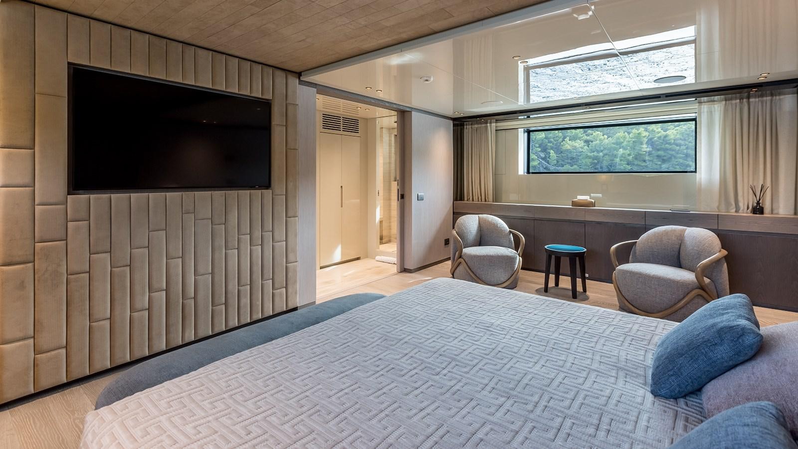 a large bed in a room aboard EROS Yacht for Sale