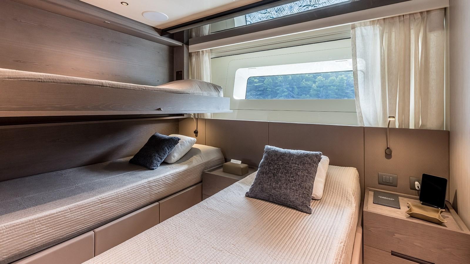 a bed with a white sheet and pillows aboard EROS Yacht for Sale
