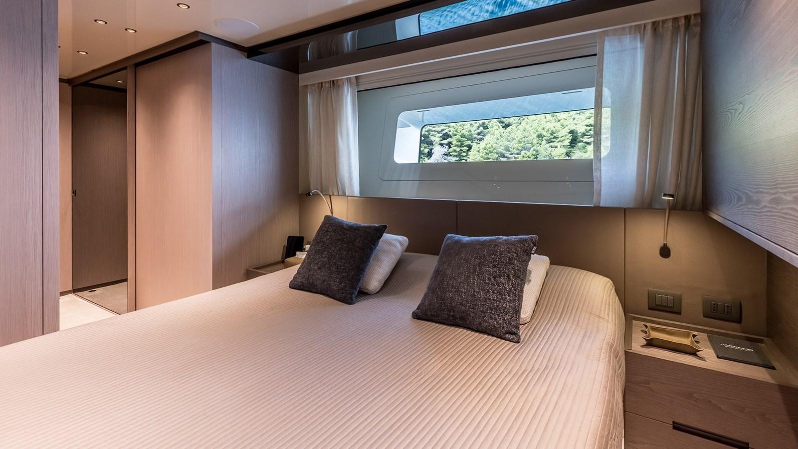 a bed with pillows aboard EROS Yacht for Sale