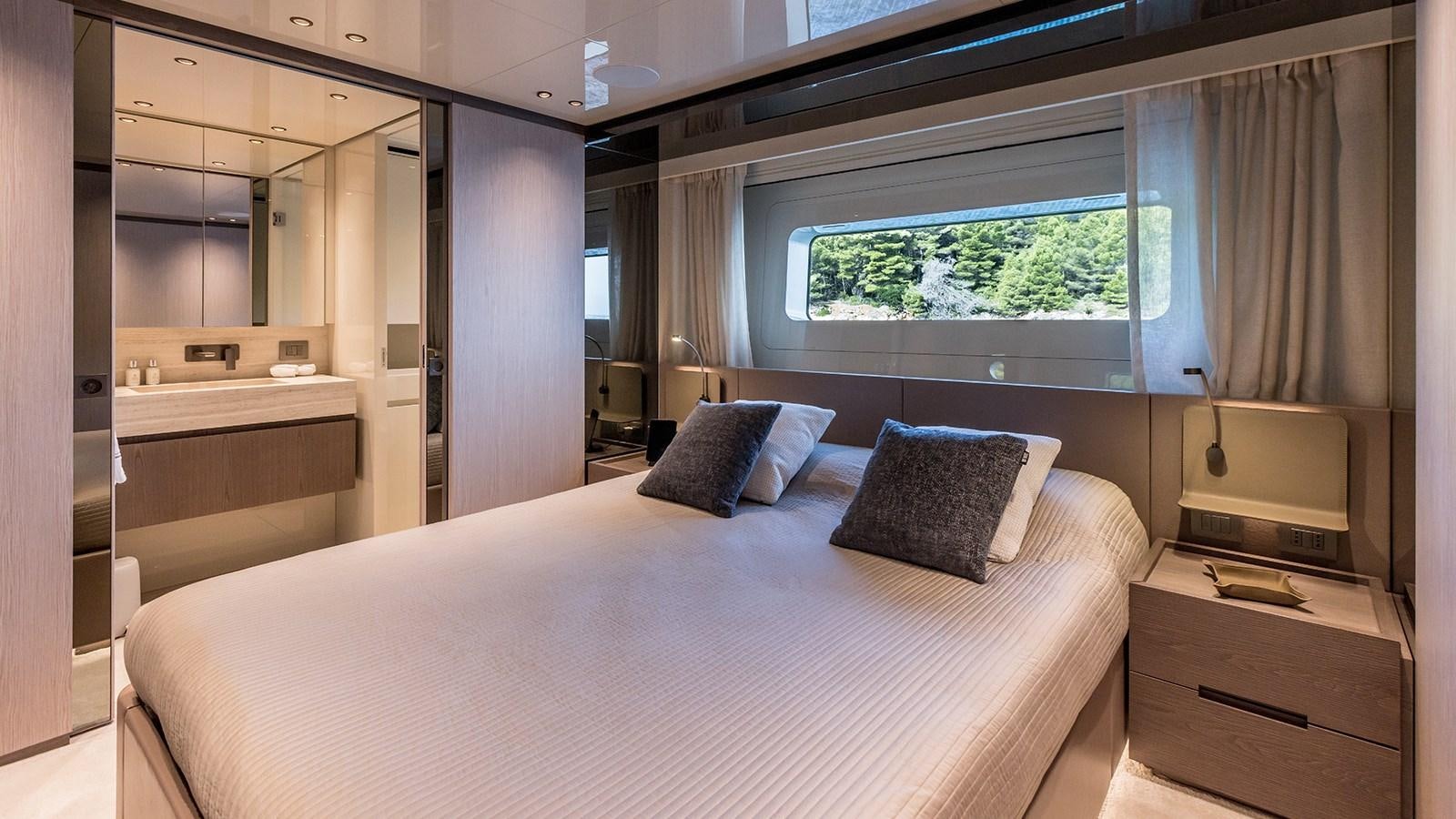 a bed in a room aboard EROS Yacht for Sale