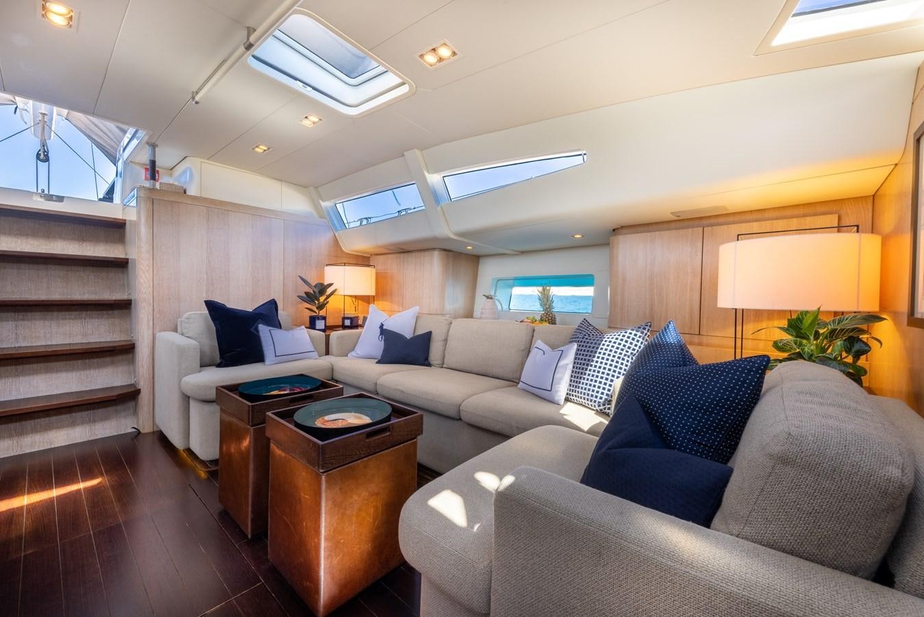 a living room with a couch and a coffee table aboard YCH2 Yacht for Sale