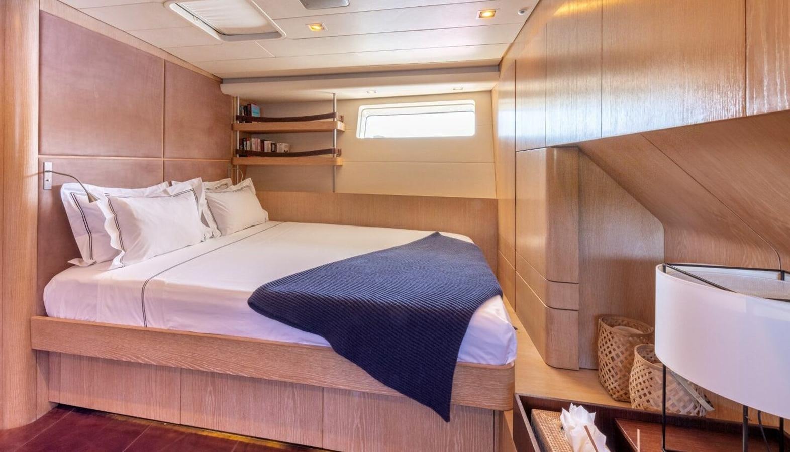 a bed in a room aboard YCH2 Yacht for Sale