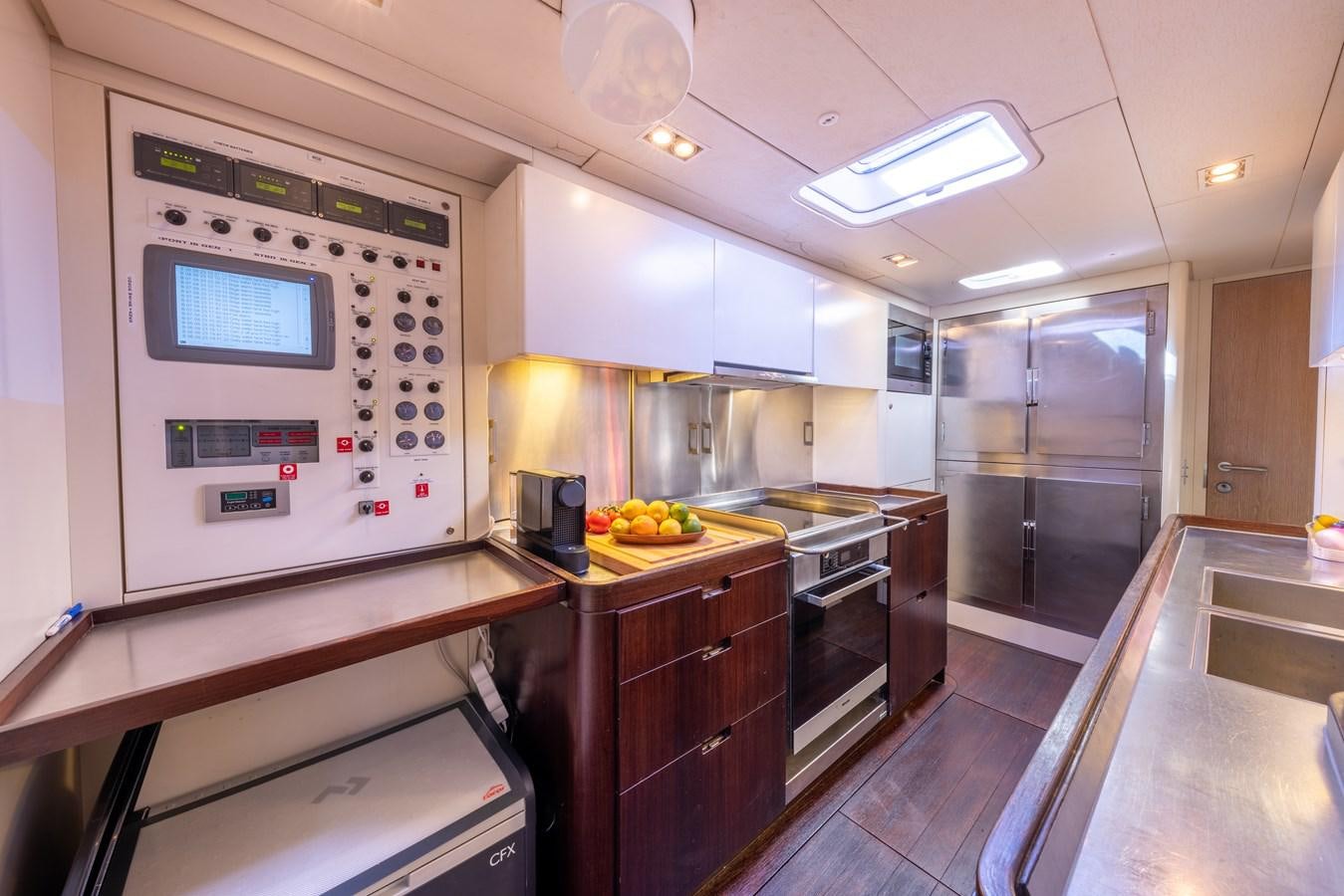 a kitchen with a stove and oven aboard YCH2 Yacht for Sale