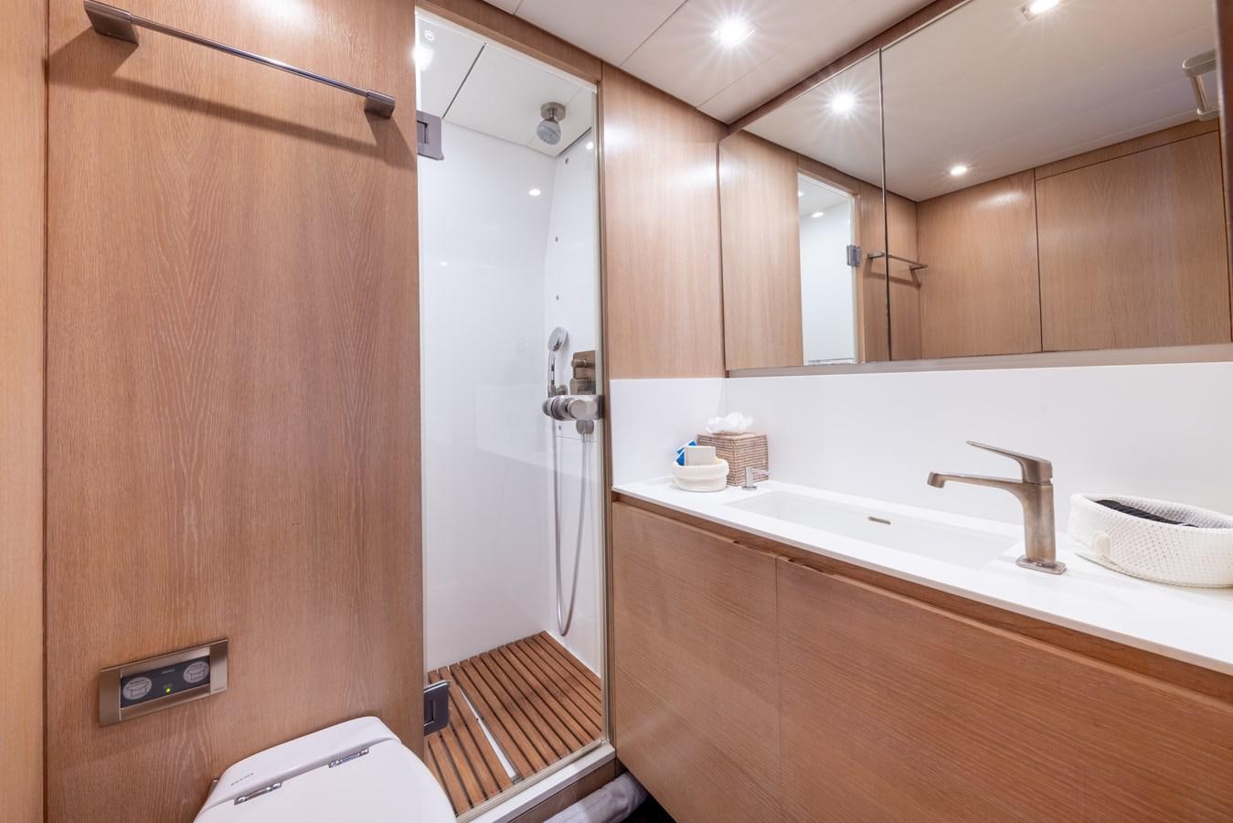 a bathroom with a shower and sink aboard YCH2 Yacht for Sale
