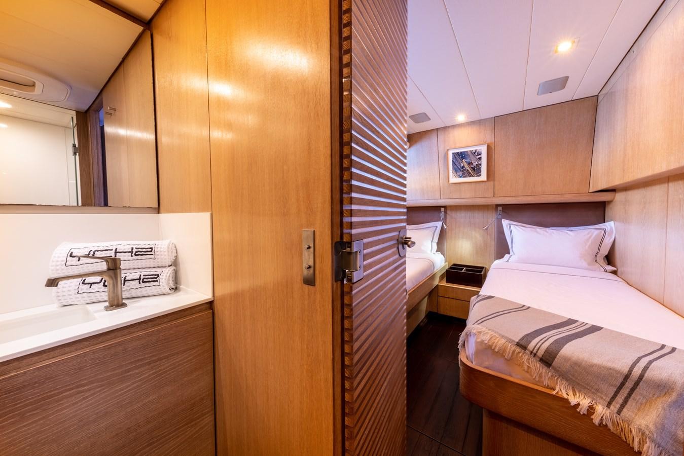 a bathroom with a couple of beds aboard YCH2 Yacht for Sale