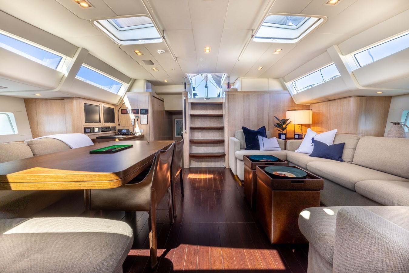 a room with a couch and a table aboard YCH2 Yacht for Sale