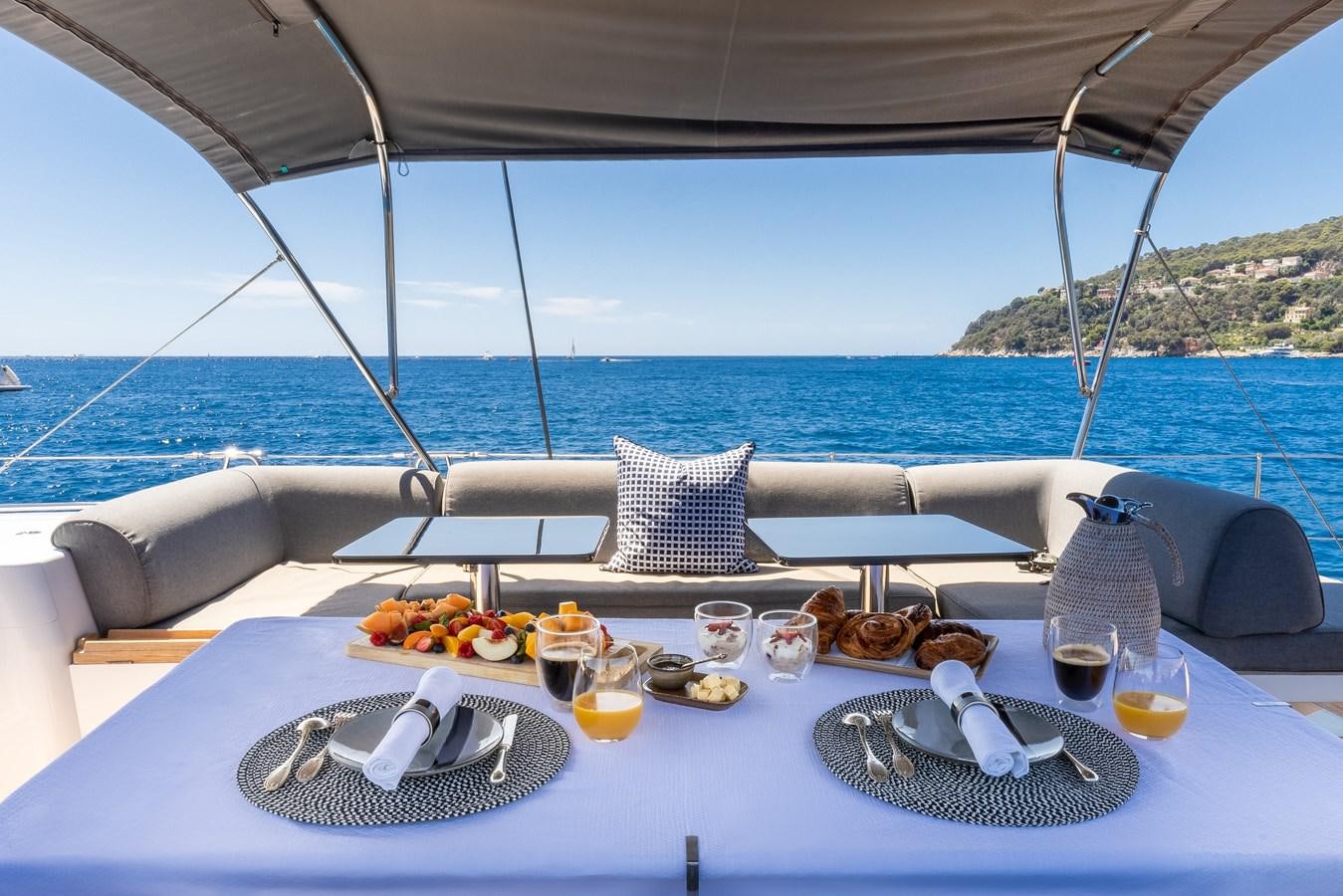 a table with food on it aboard YCH2 Yacht for Sale