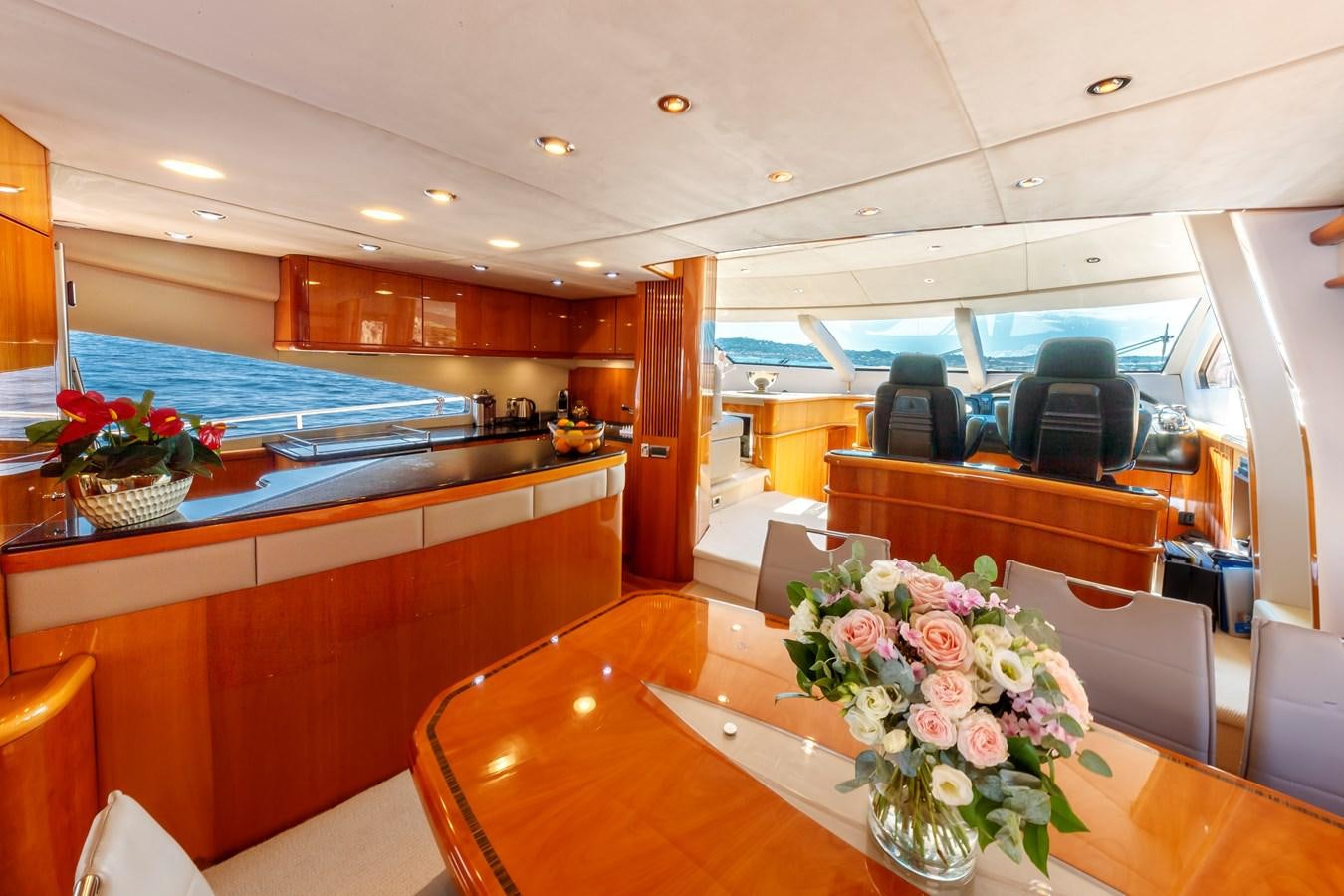 a room with a table and chairs aboard LADY YOUSRA Yacht for Sale