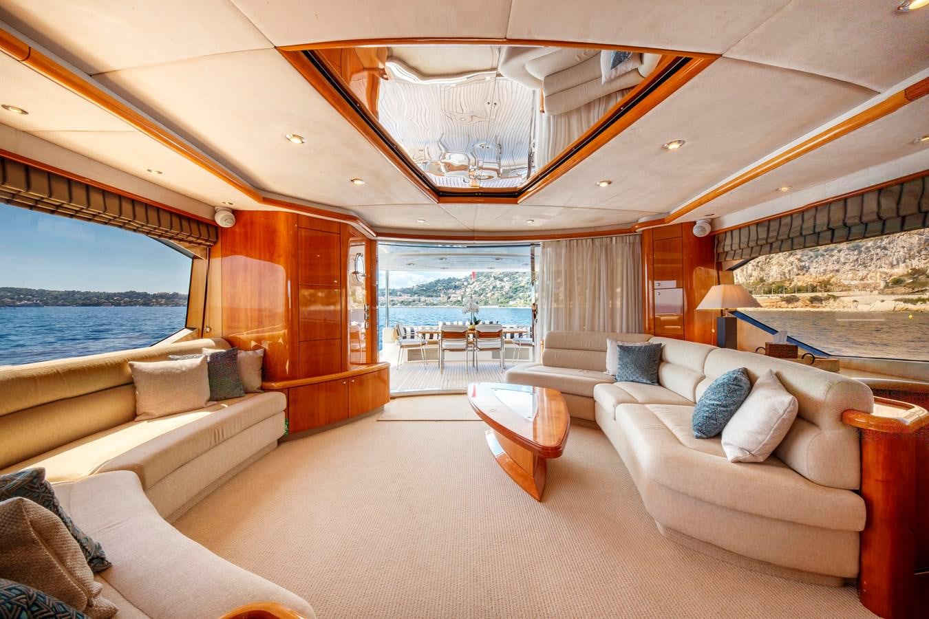 a living room with a large window aboard LADY YOUSRA Yacht for Sale