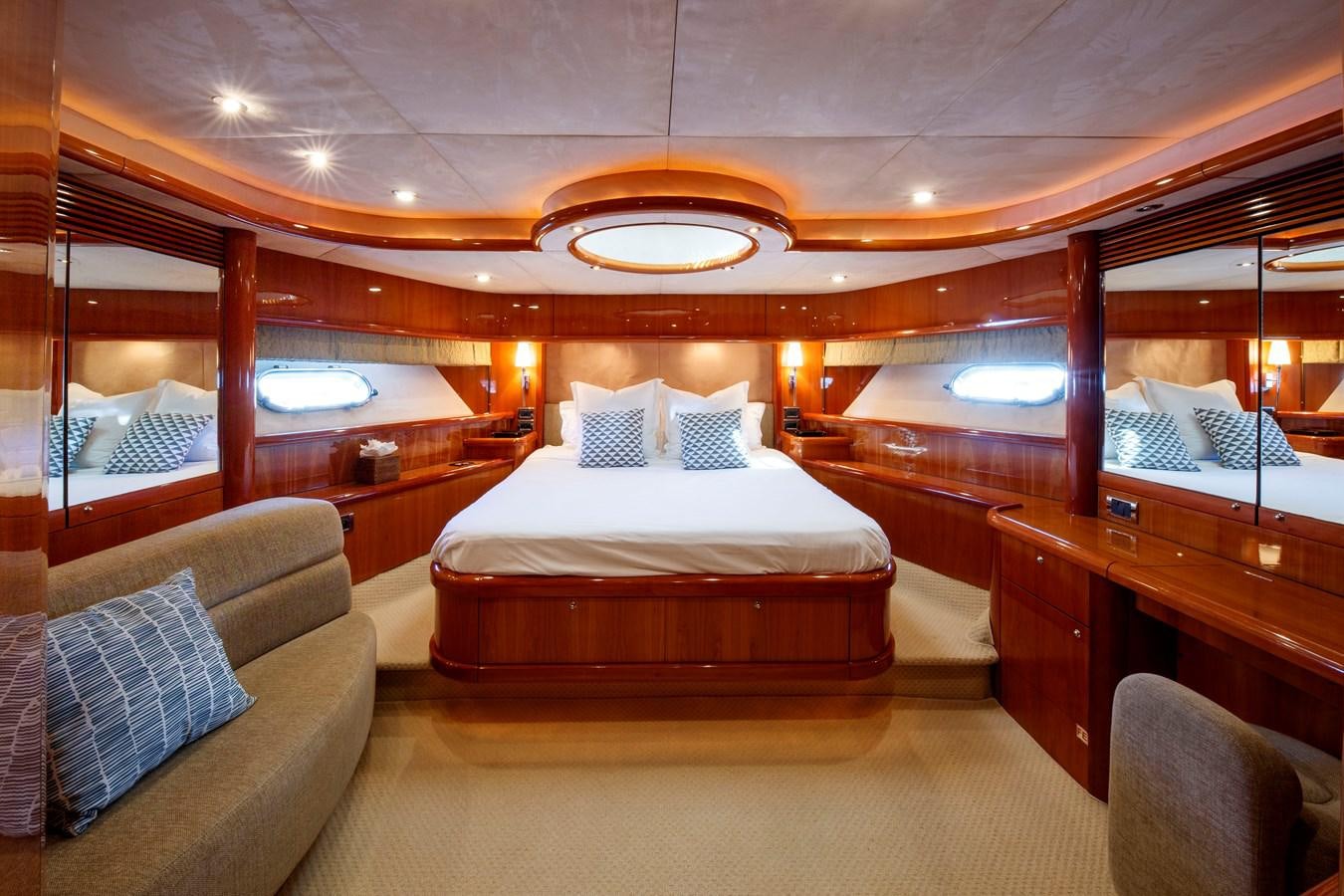 a room with a bed and a couch aboard LADY YOUSRA Yacht for Sale