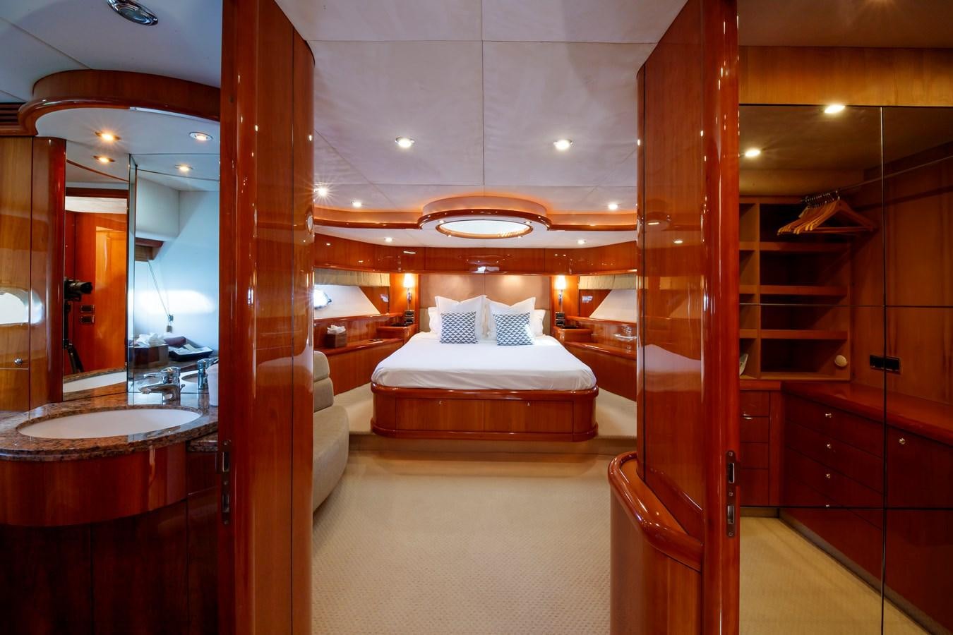 a room with a bed and a mirror aboard LADY YOUSRA Yacht for Sale