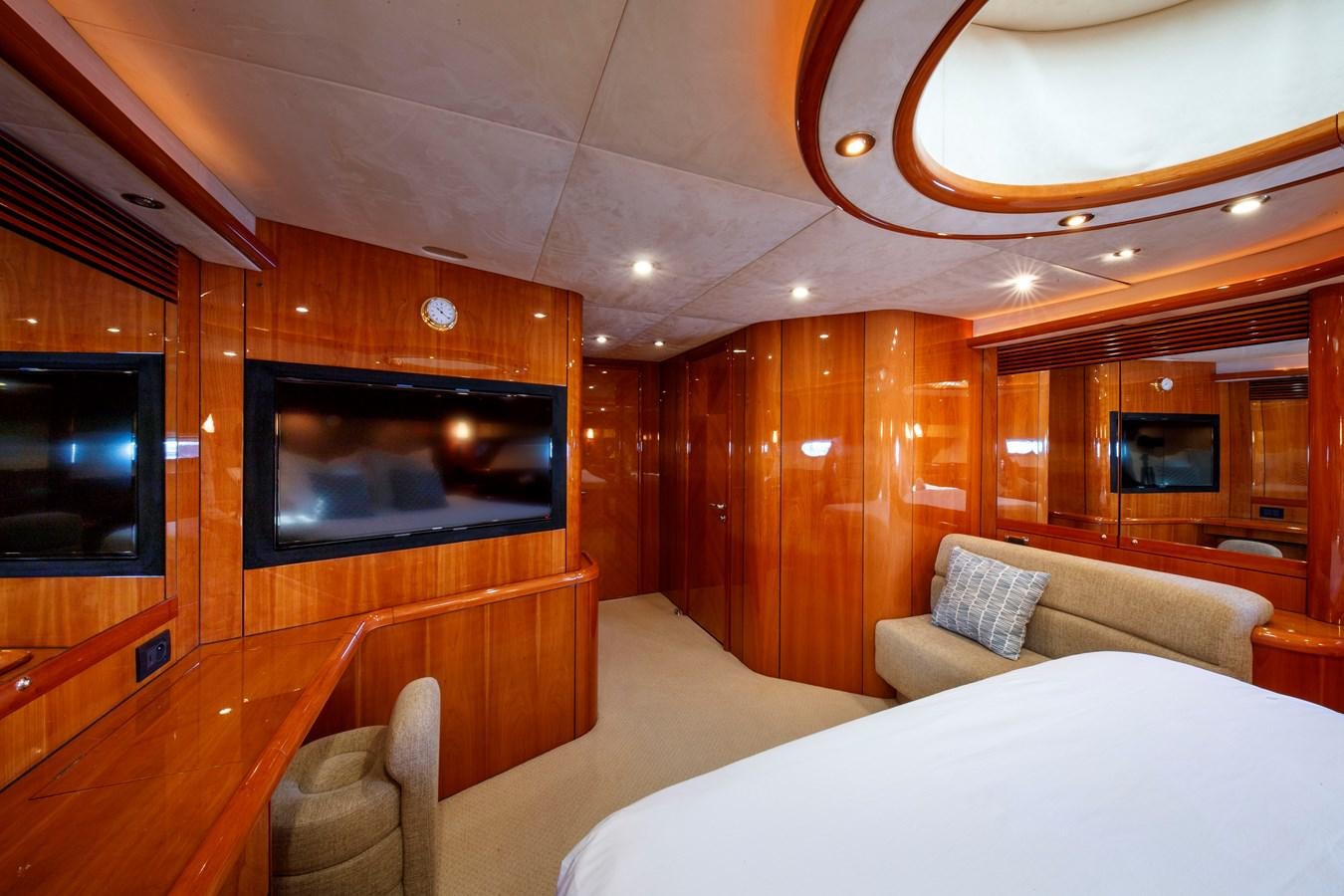 a room with a bed and a television aboard LADY YOUSRA Yacht for Sale