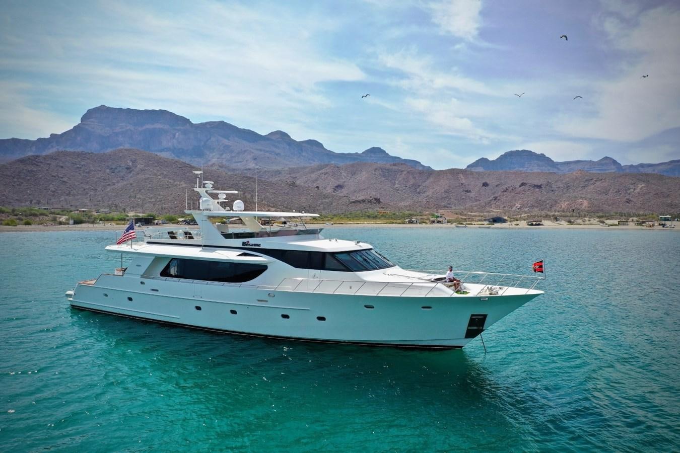 a white boat in the water aboard BESAME Yacht for Sale