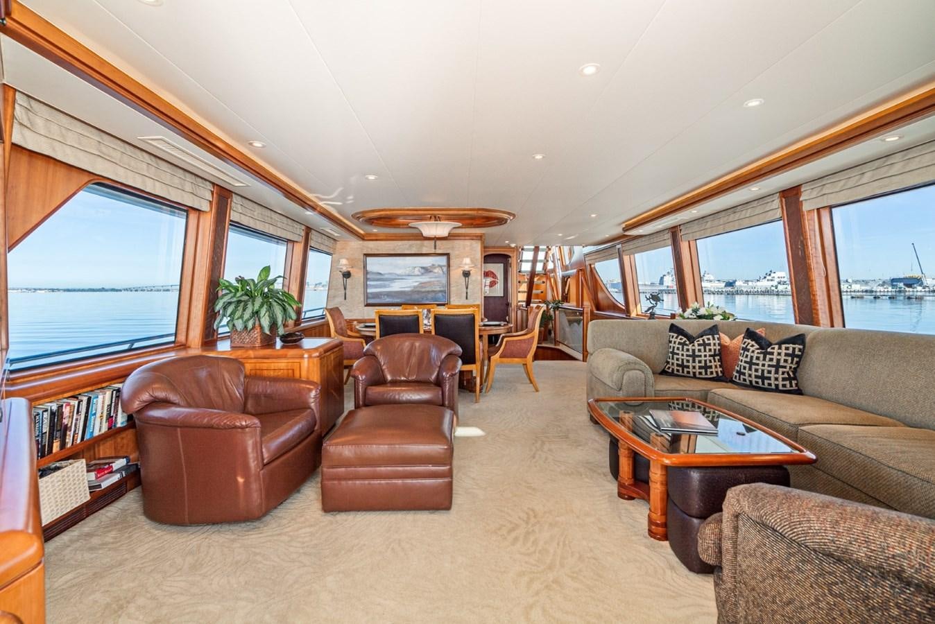 a living room with a couch and a table aboard BESAME Yacht for Sale