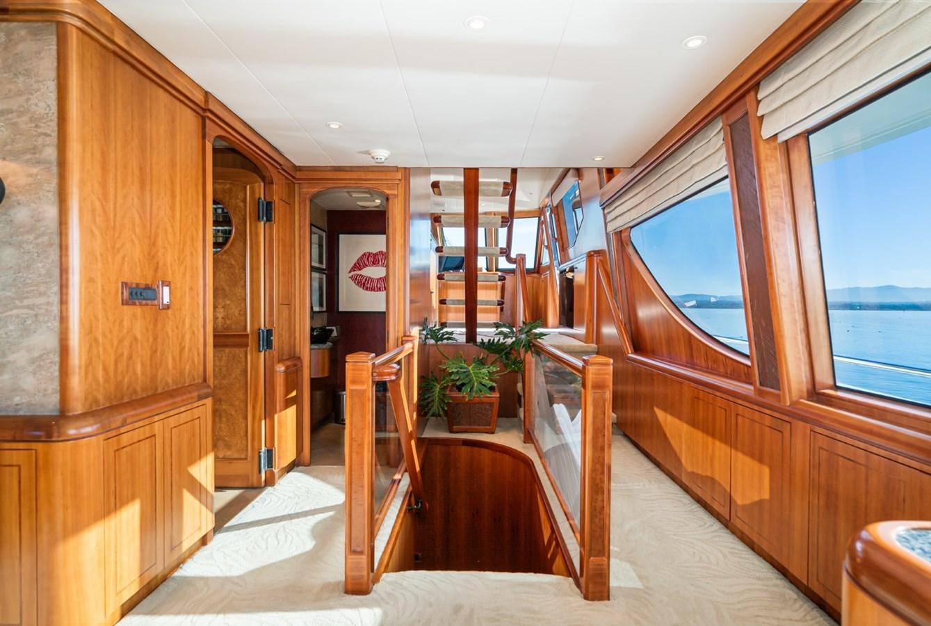 a wooden cabin with a balcony aboard BESAME Yacht for Sale