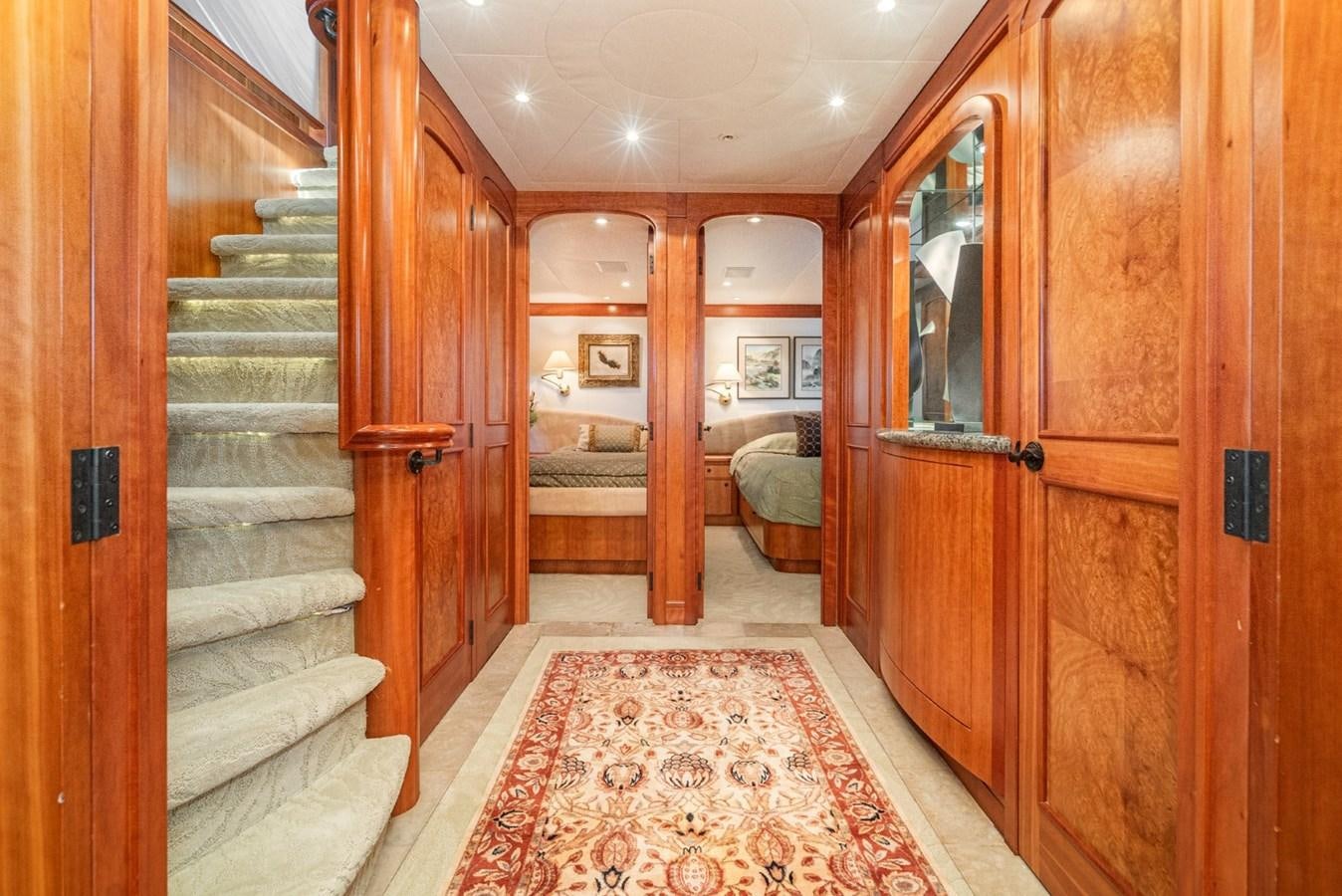a large wooden room with wooden doors aboard BESAME Yacht for Sale