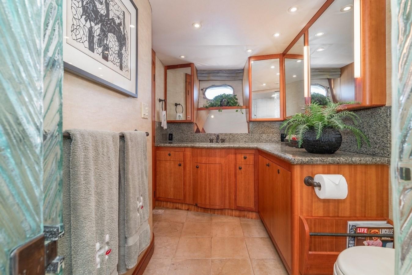 a bathroom with a sink and a mirror aboard BESAME Yacht for Sale