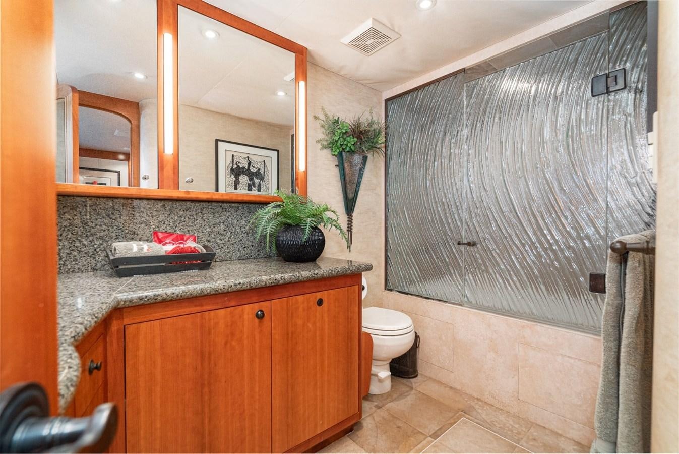 a bathroom with a sink and toilet aboard BESAME Yacht for Sale