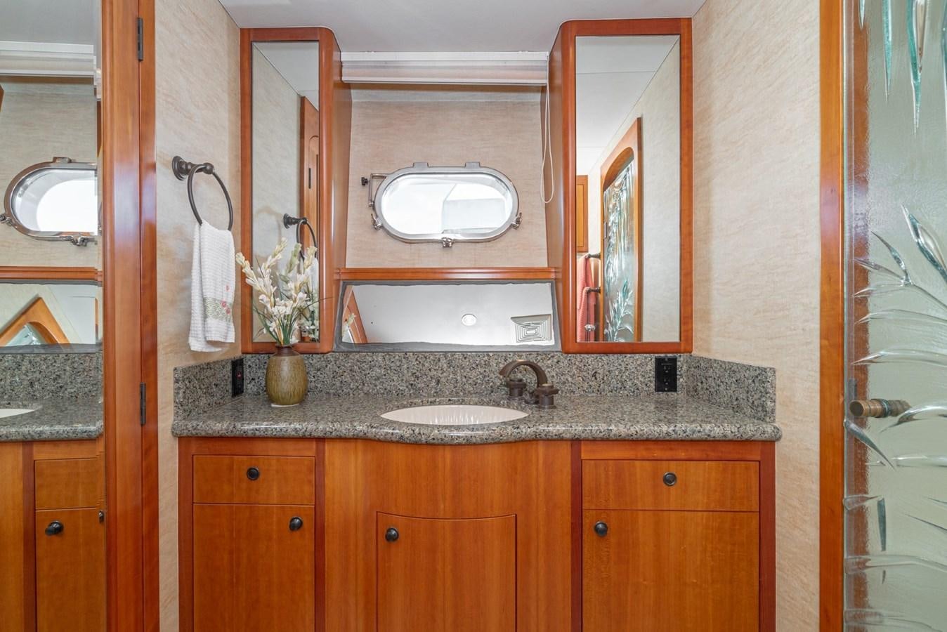 a bathroom with a marble counter top aboard BESAME Yacht for Sale