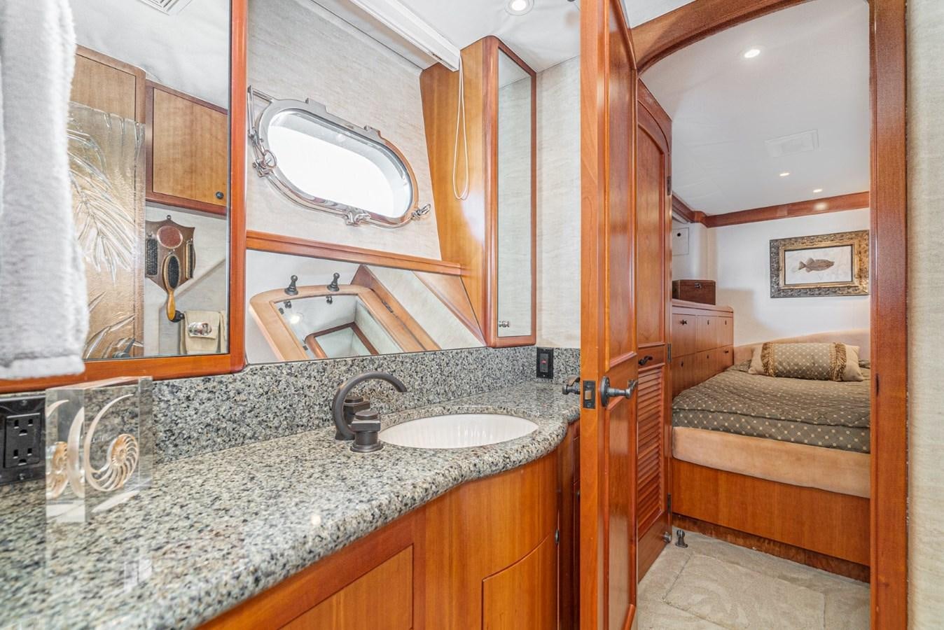 a bathroom with a sink and a mirror aboard BESAME Yacht for Sale