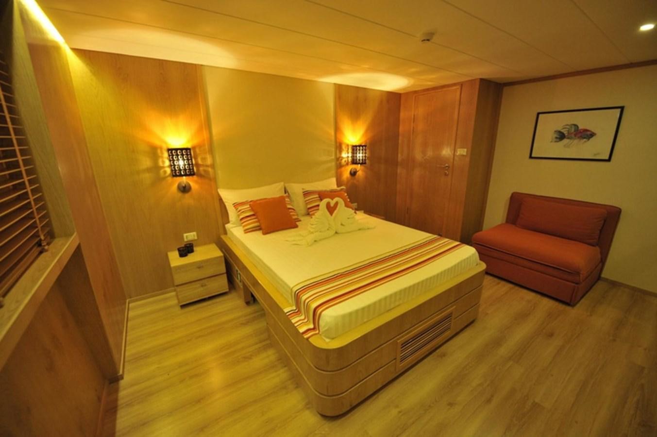 a bed in a room aboard 2017 SAFARI  142 CUSTOM Yacht for Sale