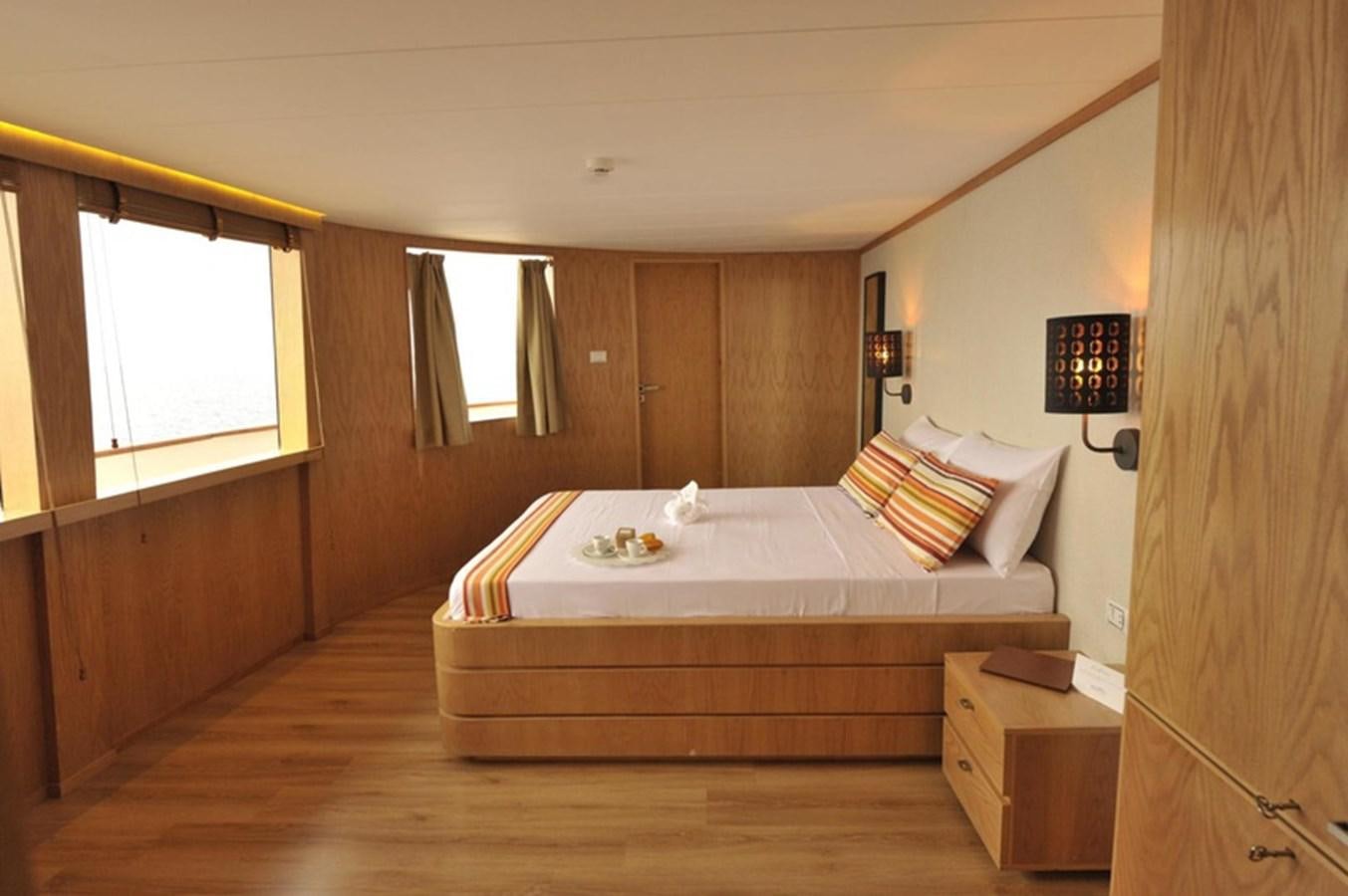 a bed in a room aboard 2017 SAFARI  142 CUSTOM Yacht for Sale