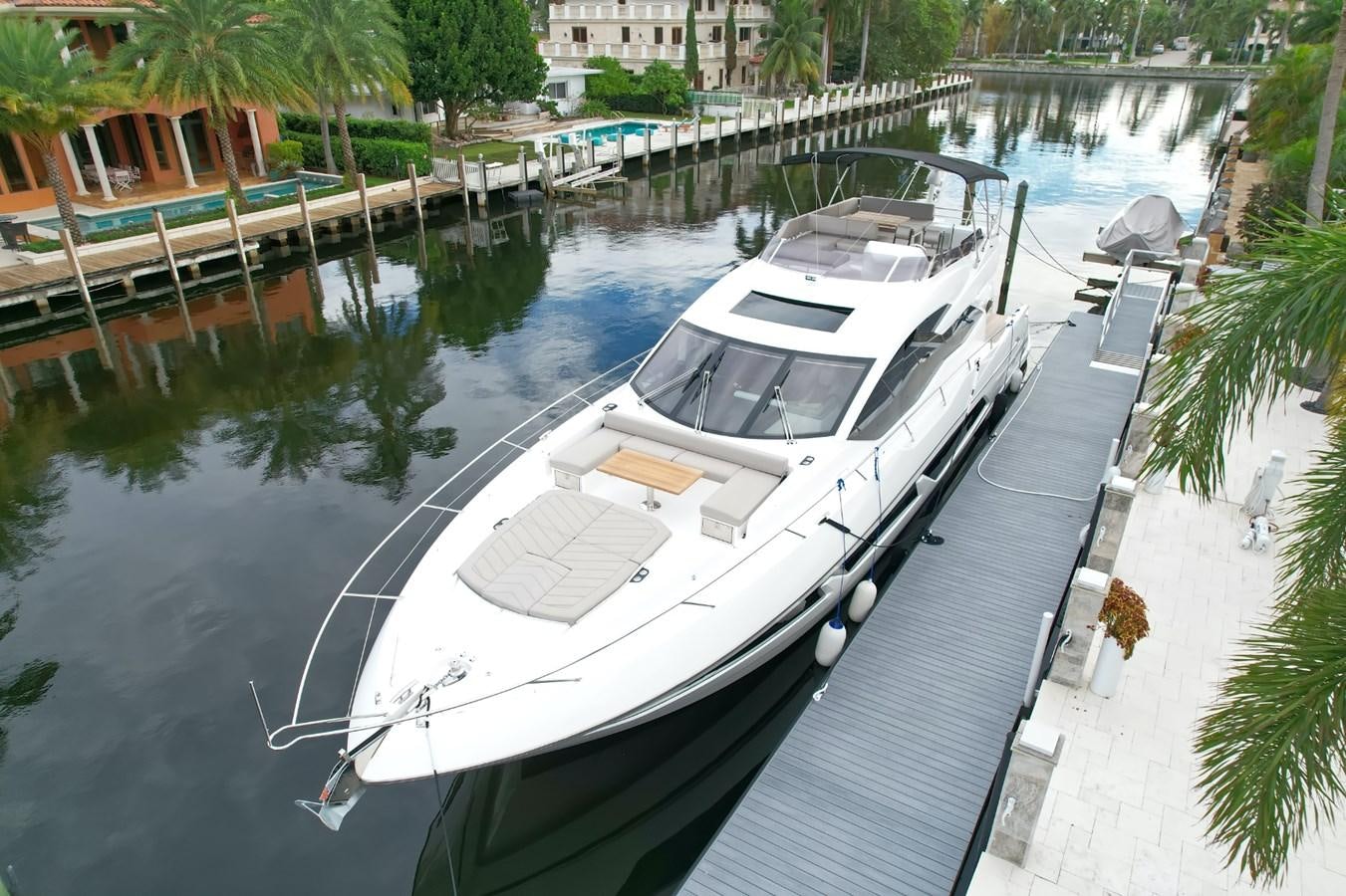 a boat docked in a harbor aboard SUNSEEKER 75 SPORT YACHT Yacht for Sale