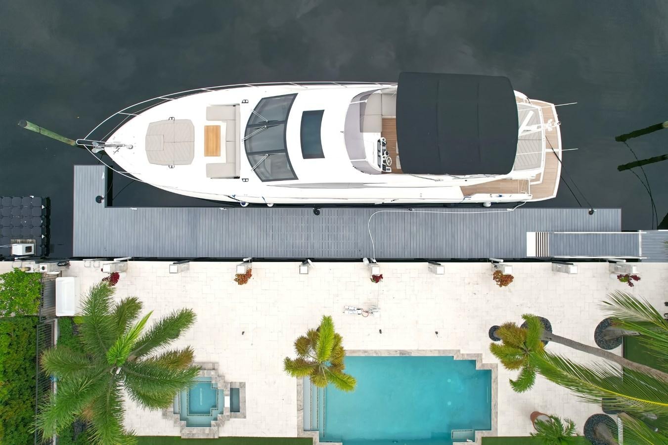 a white building with a black roof aboard SUNSEEKER 75 SPORT YACHT Yacht for Sale