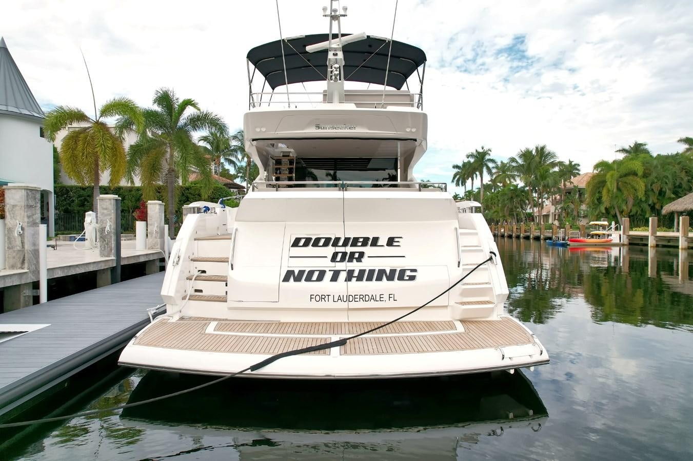 a boat docked at a pier aboard SUNSEEKER 75 SPORT YACHT Yacht for Sale