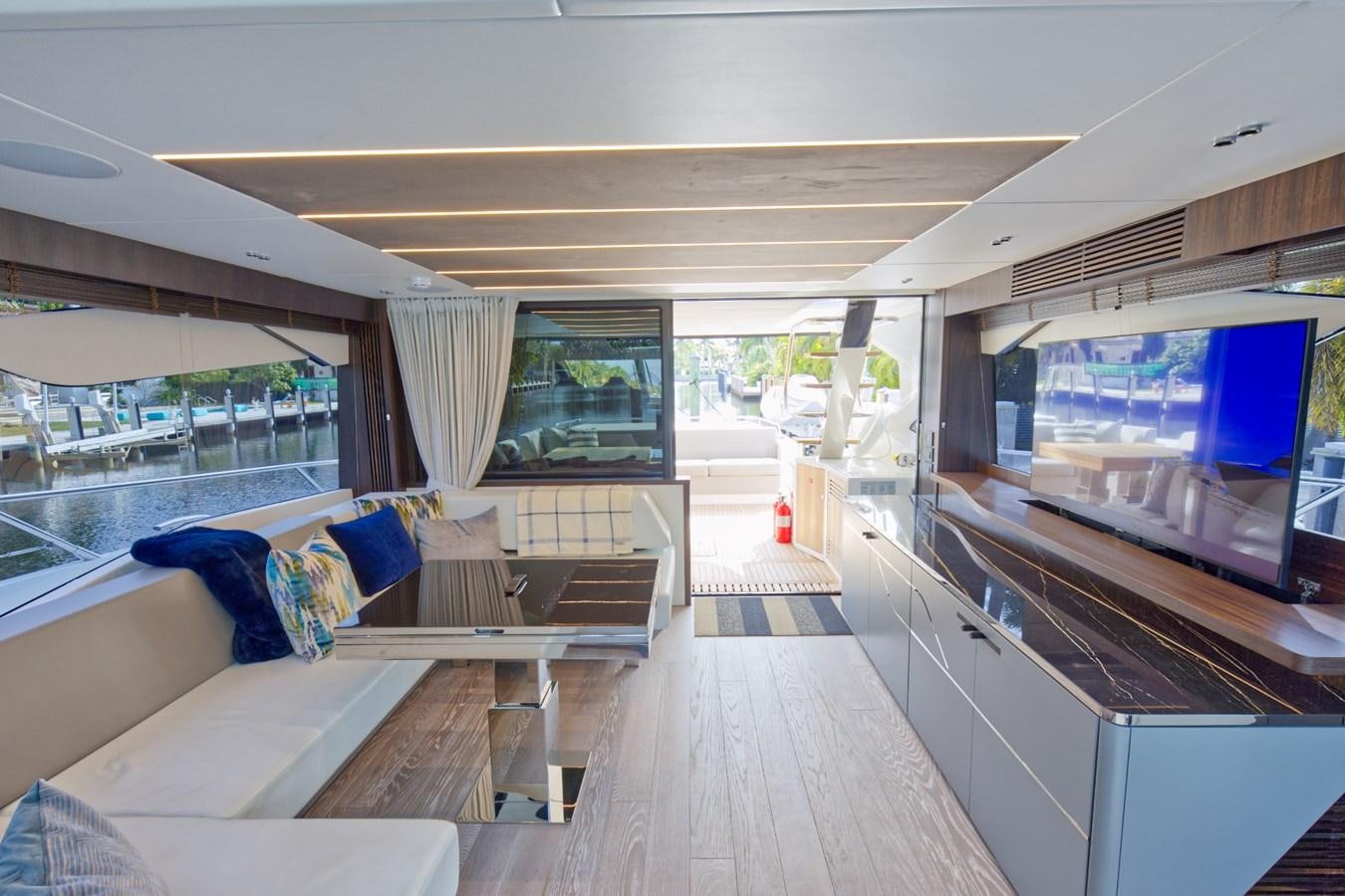 a room with a couch and a tv aboard SUNSEEKER 75 SPORT YACHT Yacht for Sale