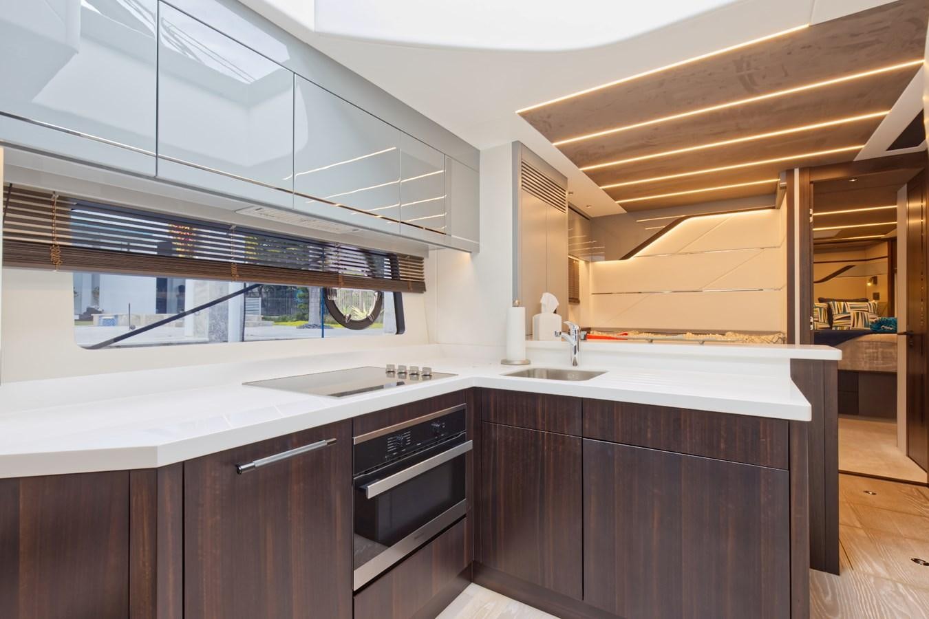 a kitchen with a white counter aboard SUNSEEKER 75 SPORT YACHT Yacht for Sale