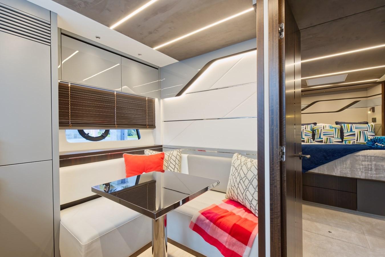 a room with a bed and a desk aboard SUNSEEKER 75 SPORT YACHT Yacht for Sale