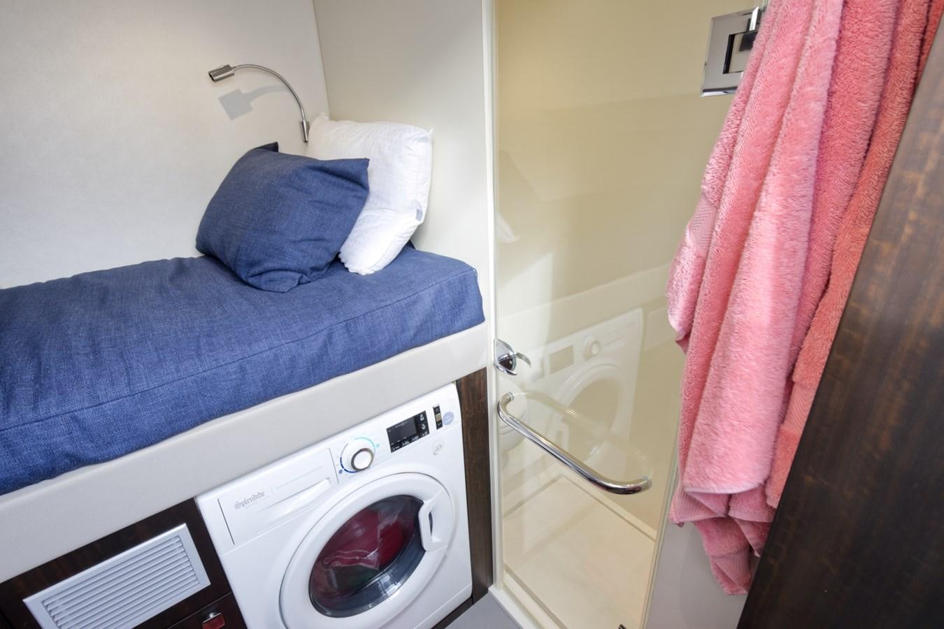a washer and dryer in a room aboard SUNSEEKER 75 SPORT YACHT Yacht for Sale
