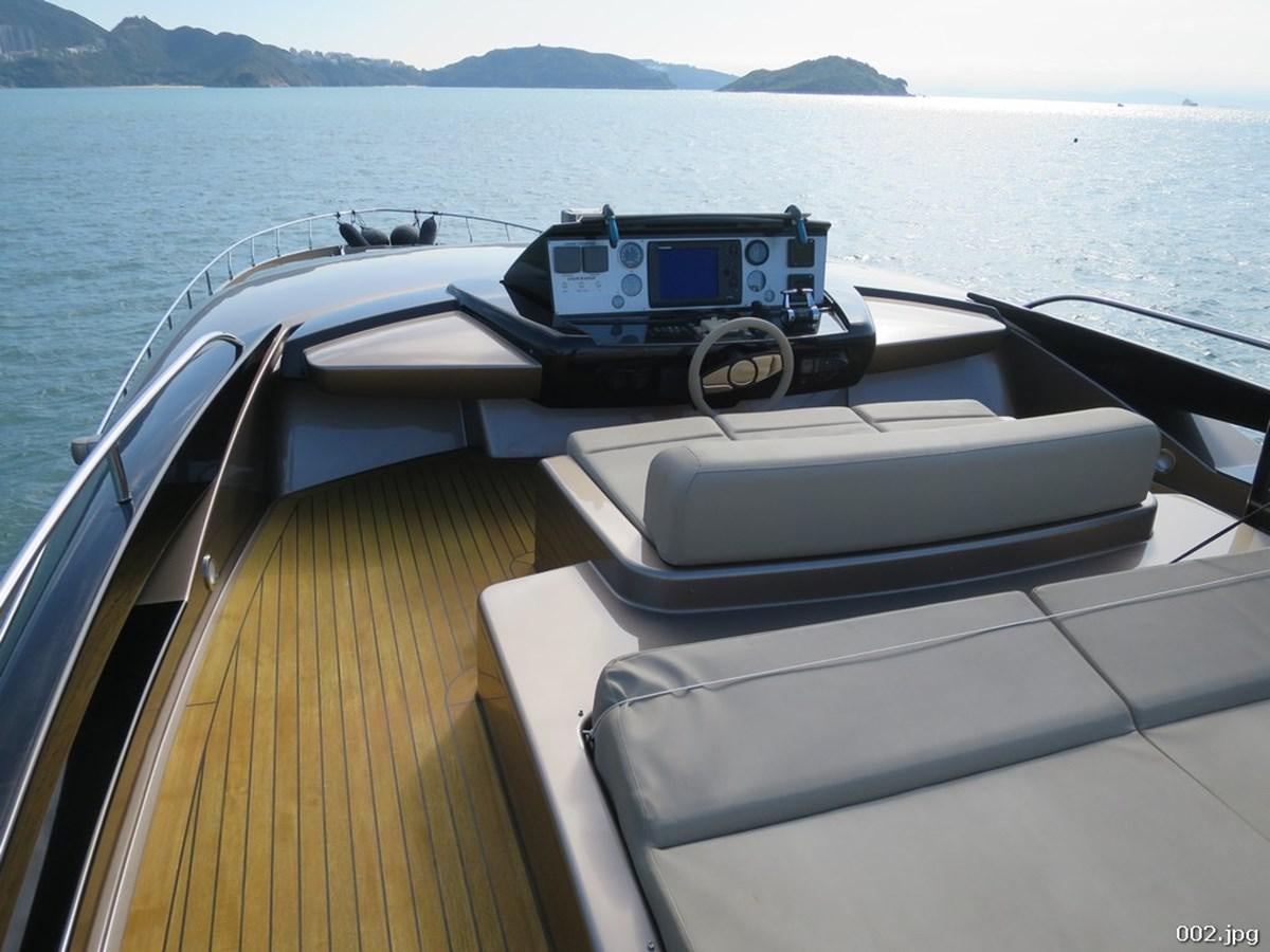 a boat with a car on it aboard RIVA 86 DOMINO Yacht for Sale