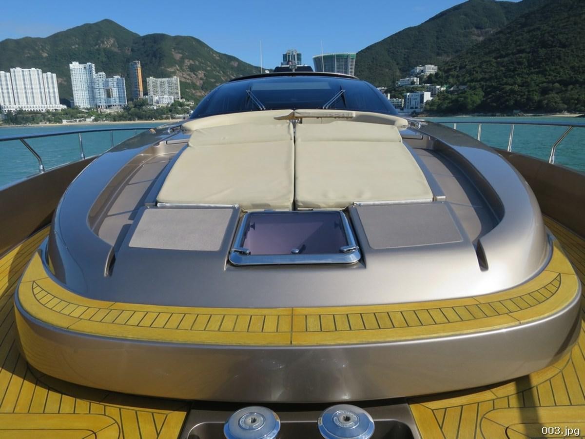 a yellow and white boat on a body of water aboard RIVA 86 DOMINO Yacht for Sale