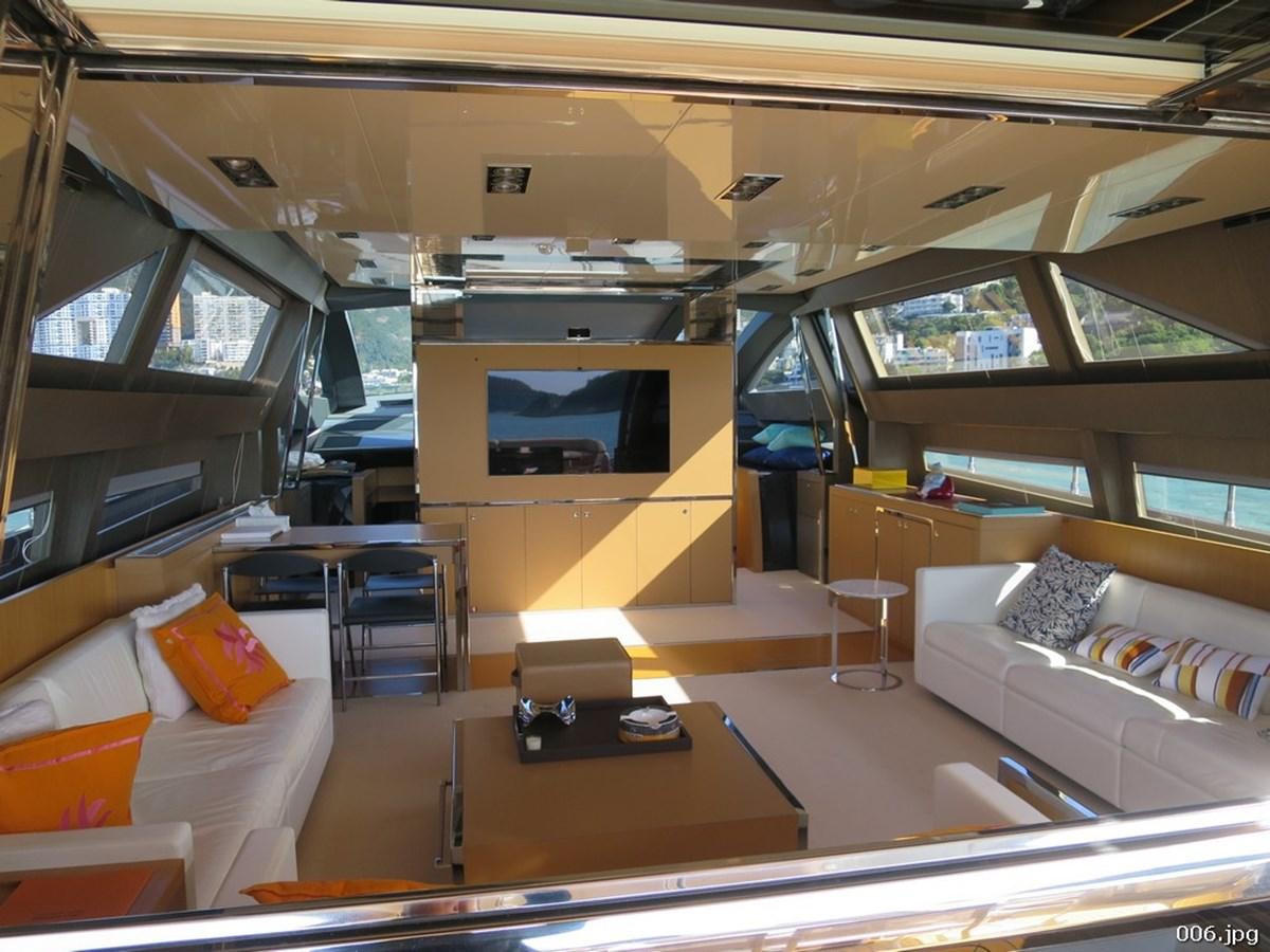 a room with a couch and a television aboard RIVA 86 DOMINO Yacht for Sale